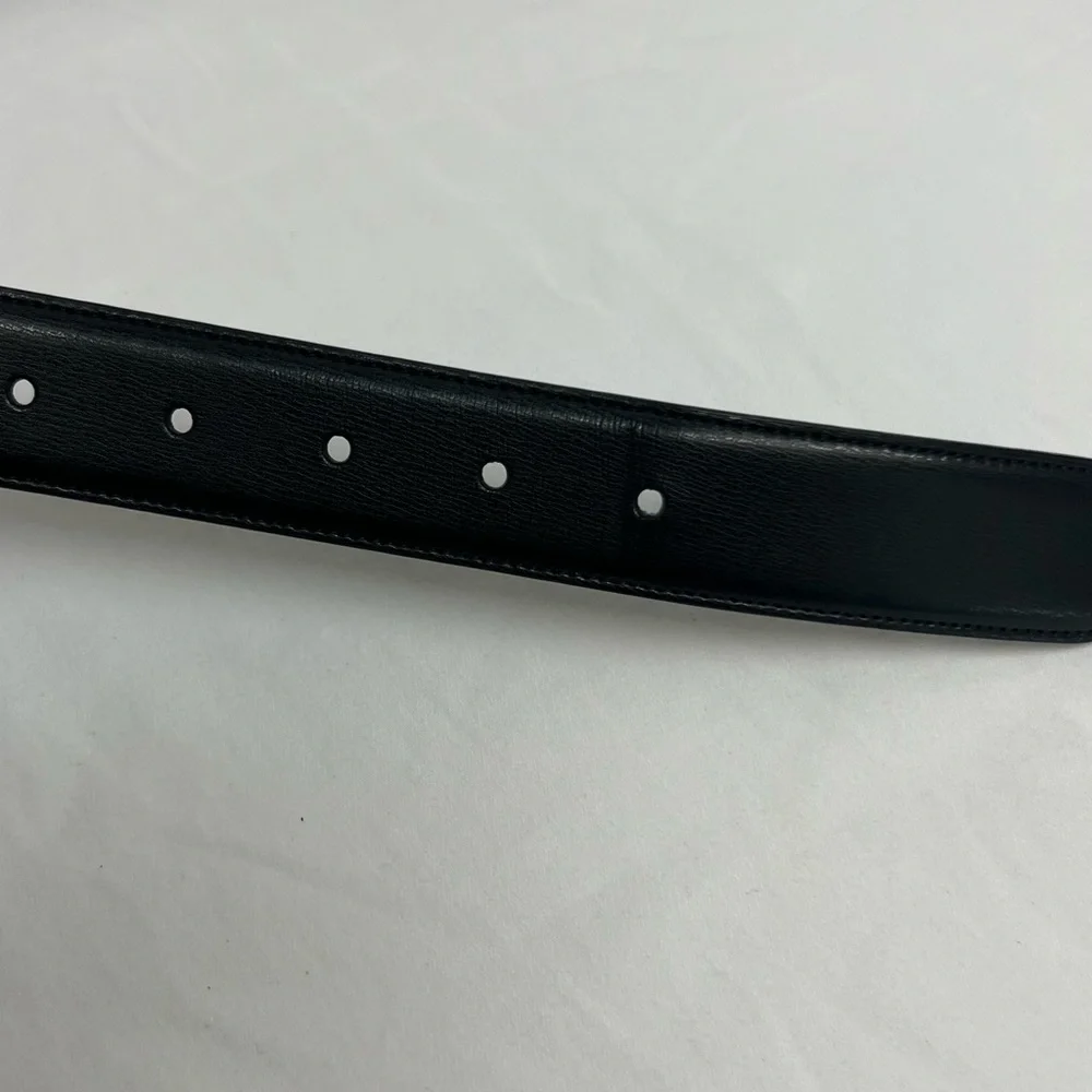 Men’s black and dark brown reversible genuine leather belt.